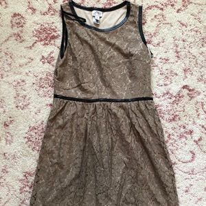 Tan lace-like sleeveless dress